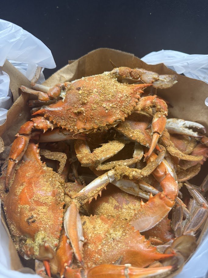 A crab house meal with hush puppies.