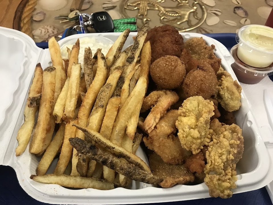 Printed menu with seafood specials.